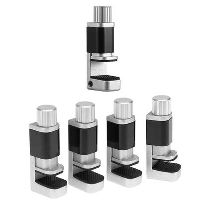Five adjustable leveling feet with black rubber pads and silver parts are set against a white background. One stands upright, resembling a MOJOYCE Adjustable Alloy Clamp for Secure Mobile Repairs, while the others lie horizontally.
