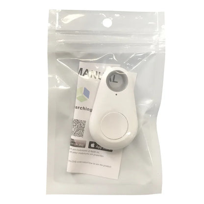 The Seamopar Mini GPS Tracker, a compact white Bluetooth Key Finder with a button, comes in a clear resealable plastic bag with a folded instruction manual visible behind the device.
