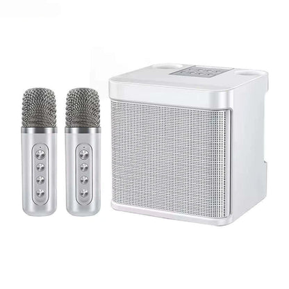 The Portable Dual Microphone Bluetooth Karaoke Machine for Parties includes a silver speaker with two wireless microphones, ideal for a karaoke experience. It features a perforated grille and button-controlled microphones, presented on a white background for sleek visual appeal.