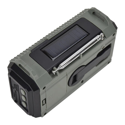 A green portable speaker with a solar panel on top and a black handle, similar to the APWIKOGER 10,000mAh Solar Hand Crank Emergency Radio. Its rugged, textured edges and rectangular shape make it ideal for outdoor adventures.