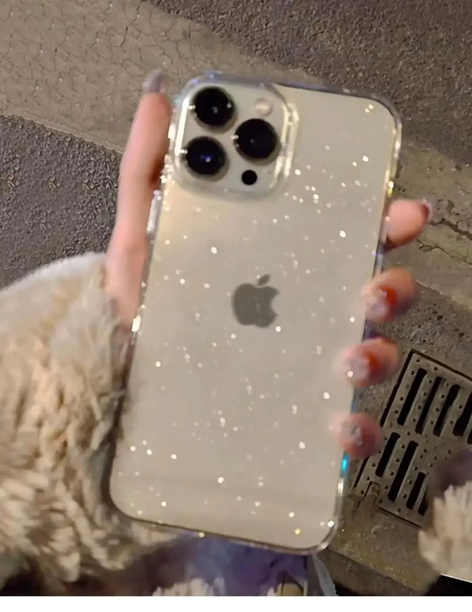 Luxury Bling Glitter Clear Phone Case for iPhone Pro Max, showcasing elegant, transparent design with sparkling details, held in hand.