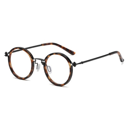 KLASSNUM Mens Round Glasses feature a retro tortoiseshell frame, thin black metal arms, anti blue light lenses, and clear nose pads. The glasses are angled stylishly on a white background.