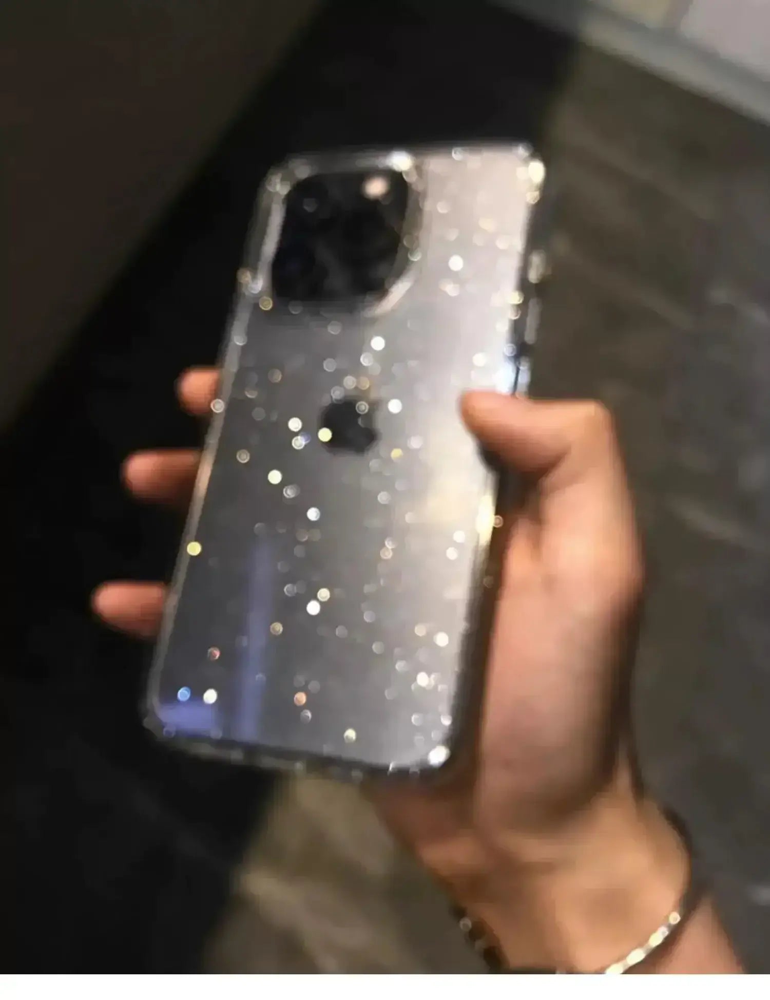 Luxury bling glitter clear phone case on iPhone Pro Max held in hand, showcasing elegance and style.