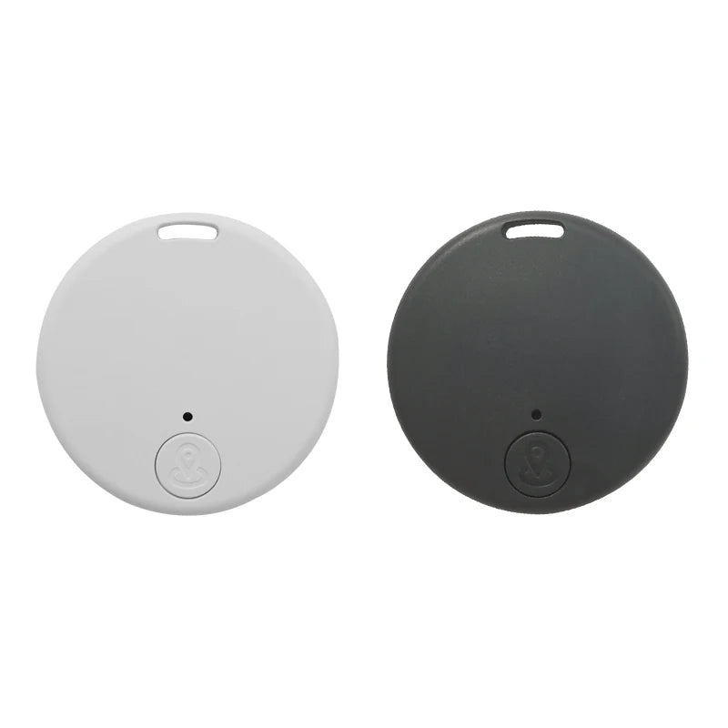 Two round flat key finders appear, one white, one dark gray. Each has anti-theft alerts, a top hole for keyrings, and a button with an anchor symbol. Keep your keys secure with Seamopar Mini GPS Tracker - Compact Anti-Lost Bluetooth Key Finder.
