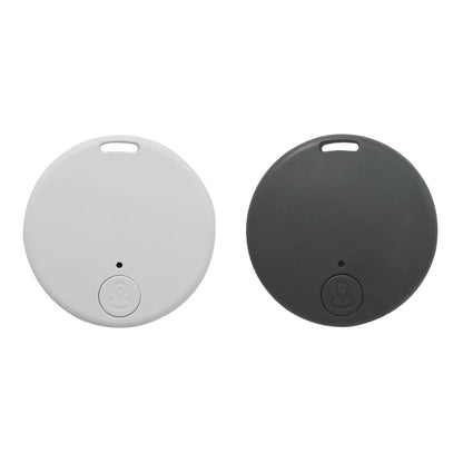 Two round flat key finders appear, one white, one dark gray. Each has anti-theft alerts, a top hole for keyrings, and a button with an anchor symbol. Keep your keys secure with Seamopar Mini GPS Tracker - Compact Anti-Lost Bluetooth Key Finder.