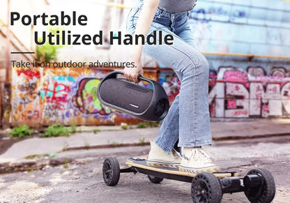 A person balances on an off-road skateboard, holding a Tronsmart Bang Speaker 60W Bluetooth with Heavy Bass & App Control. A graffiti-covered wall is in the background. The text reads: Perfect for outdoor adventures.