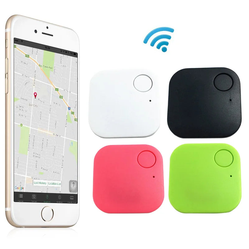 A smartphone with a map app is next to Smart Bluetooth 4.0 Anti-Lost Trackers for Valuables in white, black, pink, and green. Ideal for tracking keys or pets, a blue Wi-Fi symbol indicates seamless wireless connectivity.