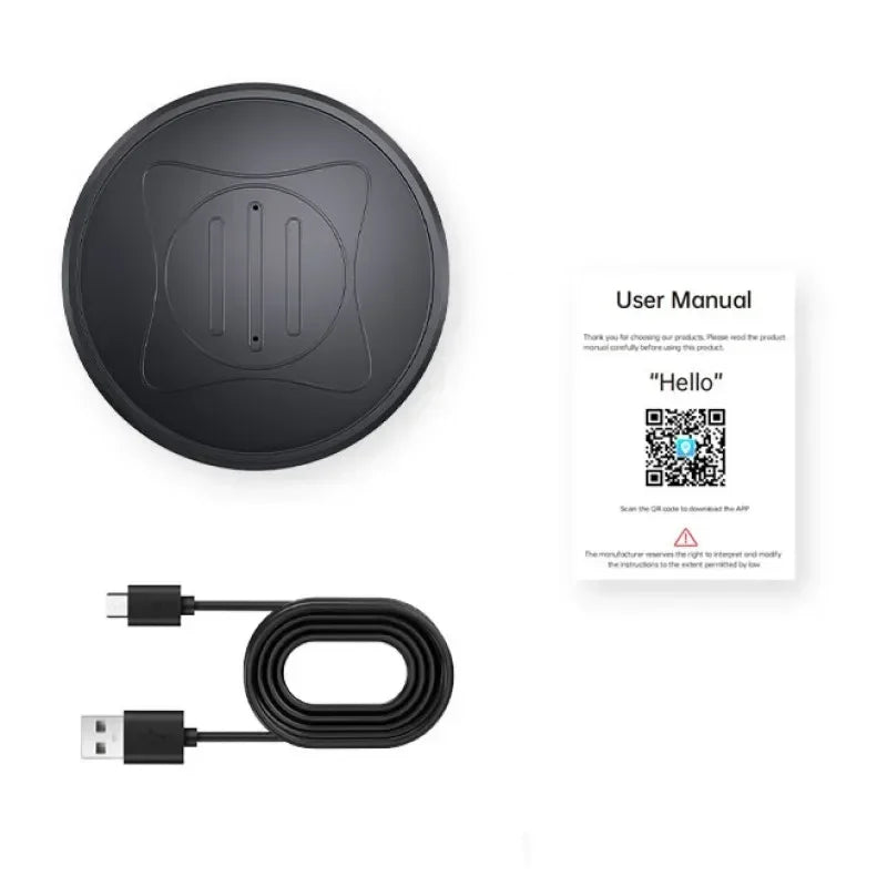 A black wireless charging pad, a user manual with QR code, and a black USB-A to USB-C cable—ideal for powering the Mini Magnetic GPS Tracker: Real-Time Pet Locator—are arranged on a white background.