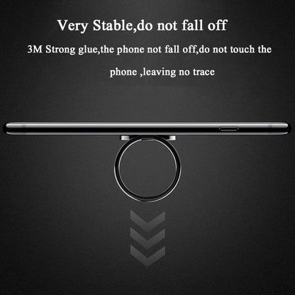A smartphone rests horizontally, supported by the Luxury Metal 360° Rotation Mobile Phone Ring Holder. Its strong 3M adhesive provides stability without leaving a trace, and allows full rotation visibility.