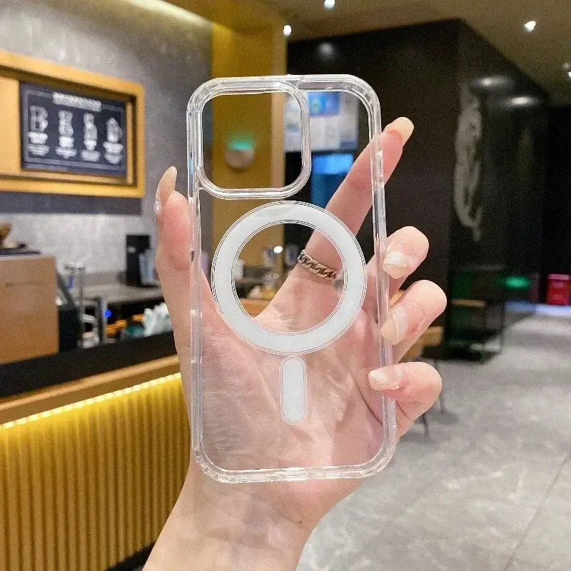 Transparent PC phone case with MagSafe compatibility for wireless charging, held in a hand, showcasing sleek design and functionality.
