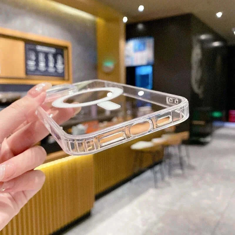 Transparent PC phone case with MagSafe wireless charging held in hand, showcasing durable design and compatibility for effortless charging.