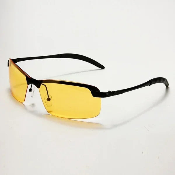 The HARKO Polarized Night Vision Cycling Sunglasses showcase yellow-tinted rectangular lenses in a chic black frame with thin black arms, ideal for outdoor adventures. They rest elegantly on a plain white surface.