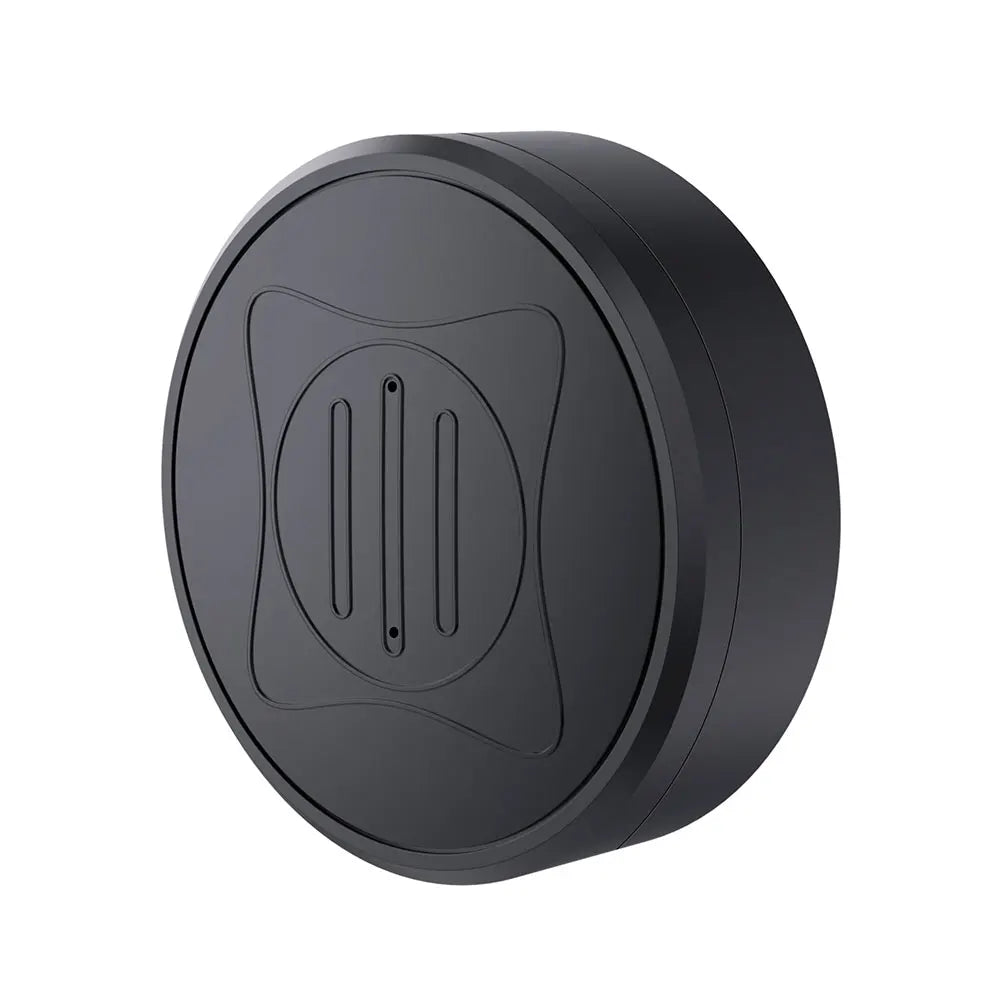 The Mini GPS Tracker is a round, black charging pad with a sleek design. It features a raised circular area with vertical grooves and subtle X-pattern etchings, integrating real-time tracking capabilities for enhanced functionality.