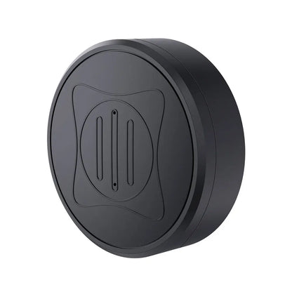 The Mini GPS Tracker is a round, black charging pad with a sleek design. It features a raised circular area with vertical grooves and subtle X-pattern etchings, integrating real-time tracking capabilities for enhanced functionality.