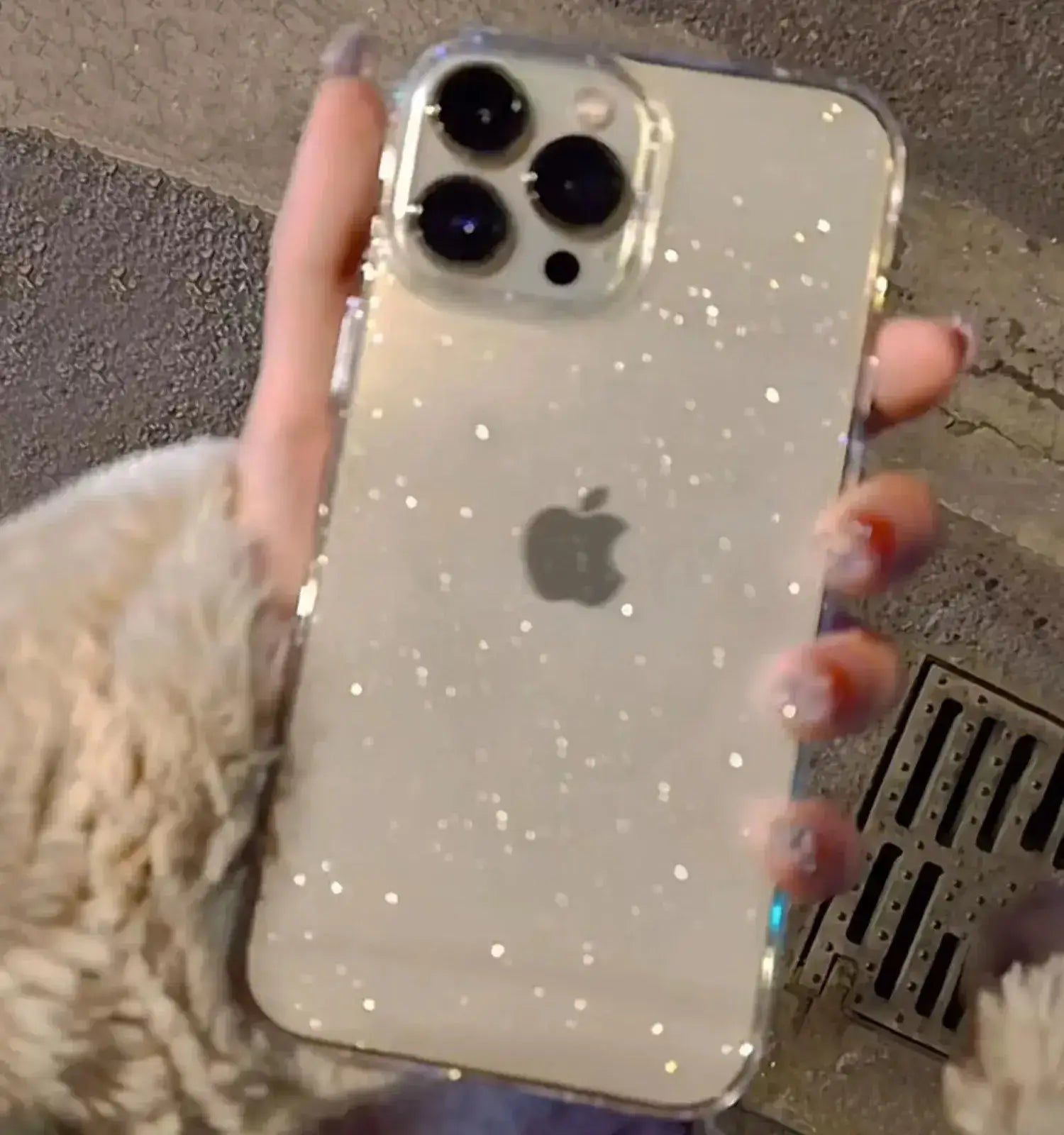 Luxury Bling Glitter Clear Phone Case for iPhone Pro Max, showcasing sparkling design and transparent build in hand.