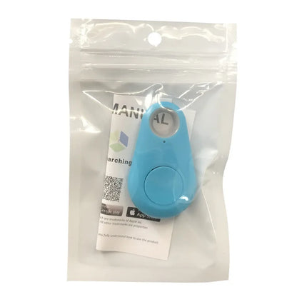 The Seamopar Mini GPS Tracker, a small blue device, comes in a clear resealable bag with a visible manual. QR codes and logos for Google Play and Apple App Store on the packaging enable easy setup with anti-theft alerts.