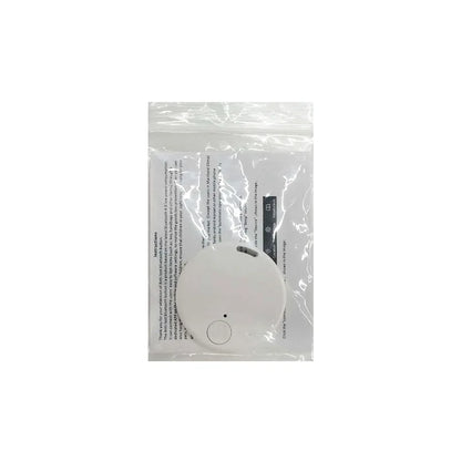 The Seamopar Mini GPS Tracker, a white, round key finder, is nestled in transparent plastic packaging with visible instructions on white paper and an included battery. Featuring a small button, it promises to be your go-to anti-theft alert device.