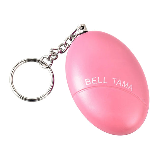 The KERUI 120dB Keychain Alarm is a pink, oval portable self-defense device with BELL TAMA printed on it, attached to a metal key ring by a short chain—ideal for women’s safety.